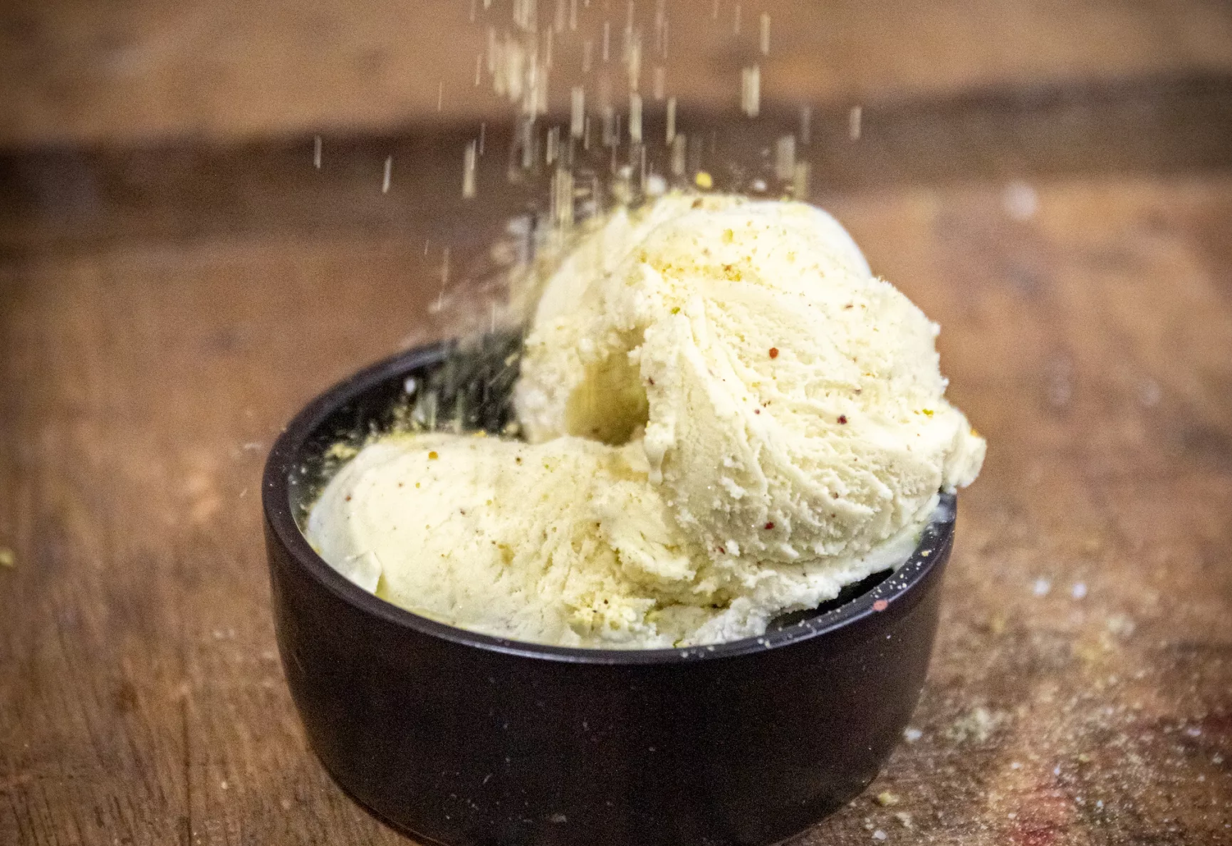 Pistachio crumb sprinkled over gelato