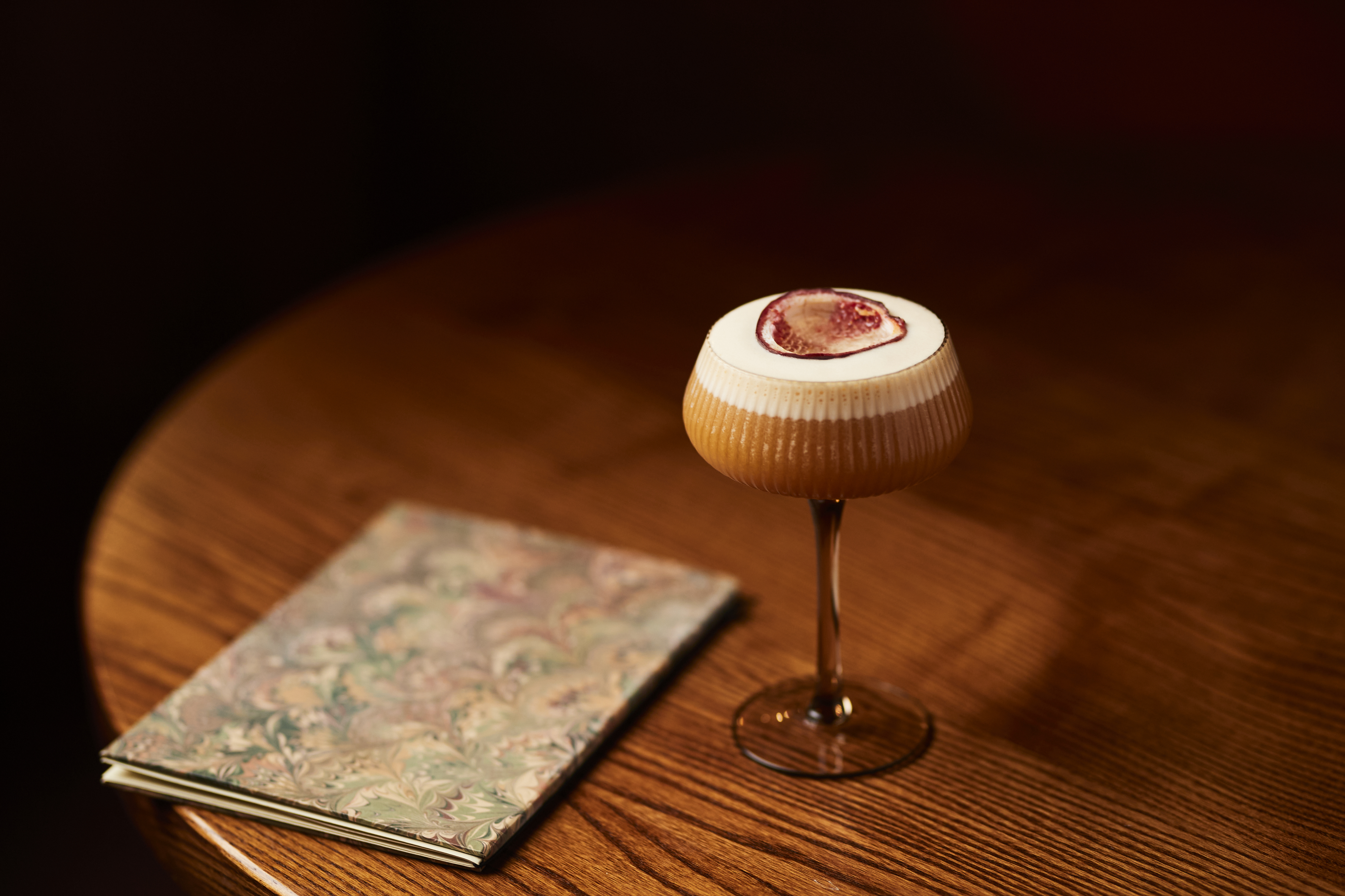 A Pornstar Martini next to a menu.