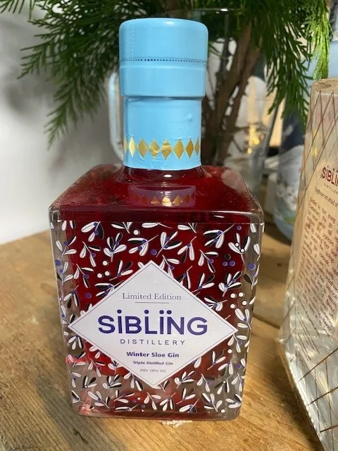 Sibling Winter gin in a square bottle with a pale blue cap
