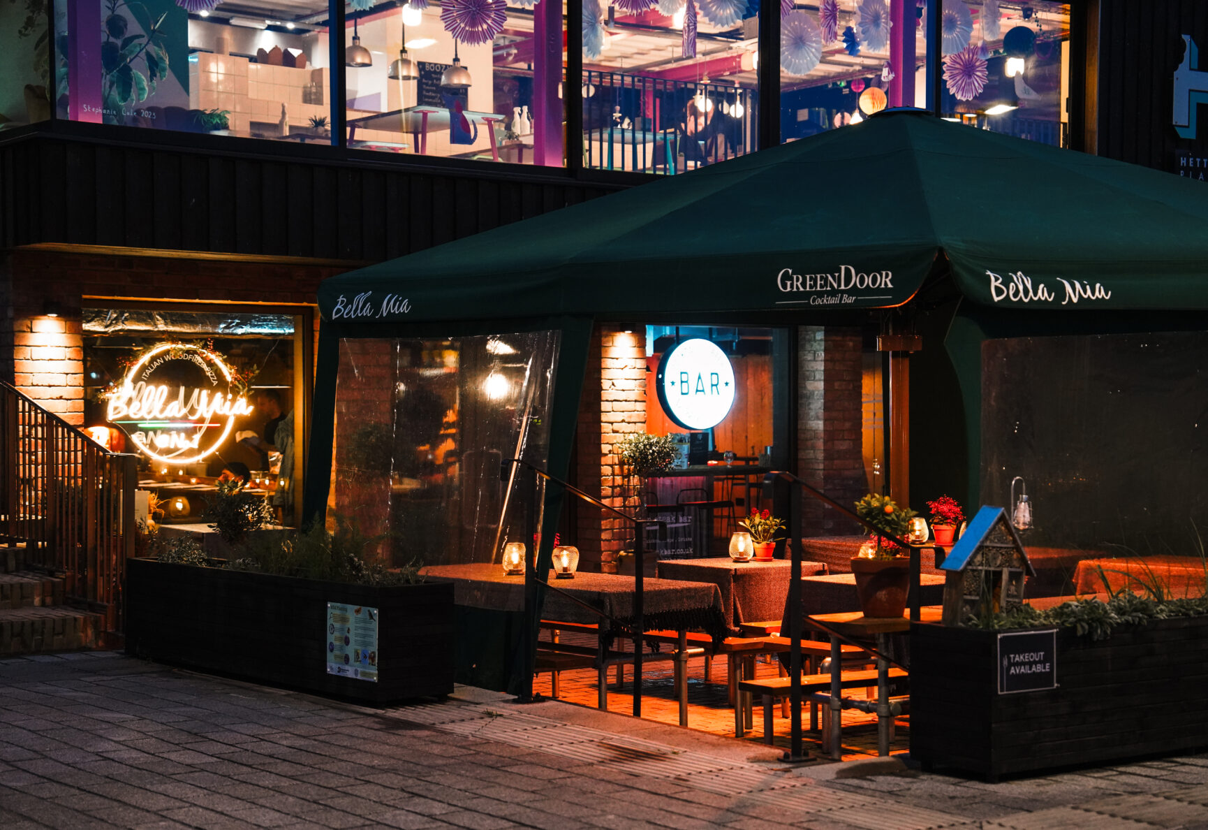 Bella Mia Pizza outside seating with heaters.