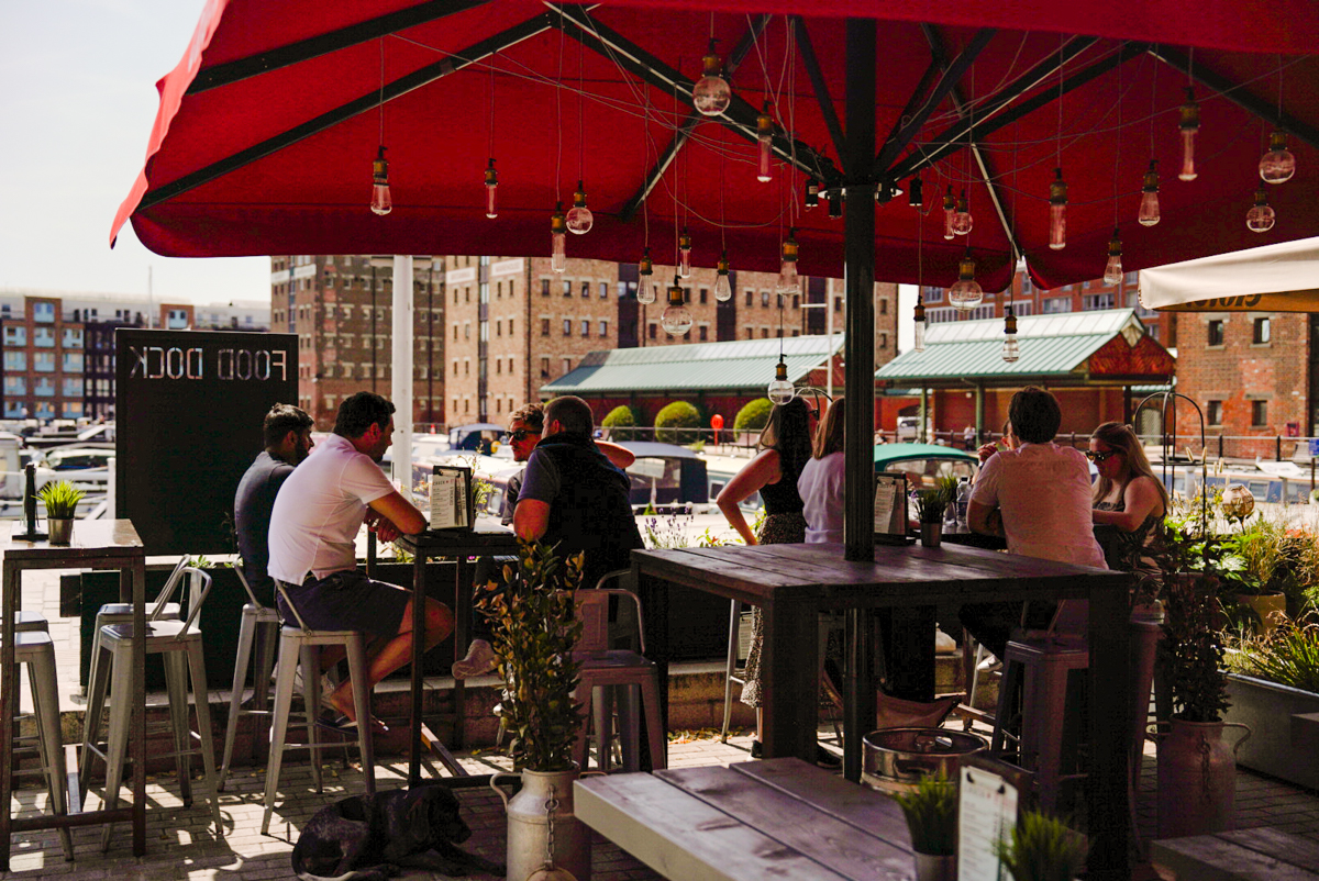 Outside seating area of Chuck with a view of Gloucester Docks behind.