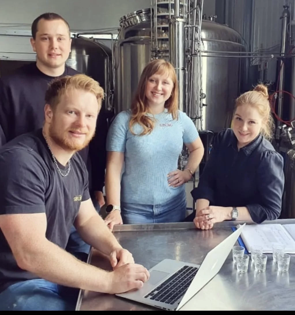 The siblings in their distillery