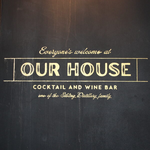 The Our House logo painted on their outside wall.