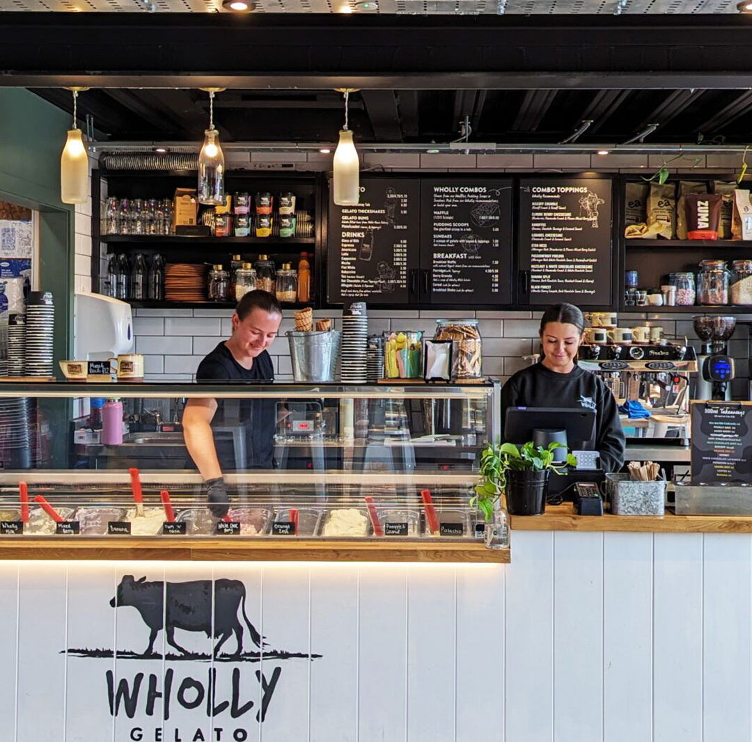 Smiling staff stood at the gelato bar in Wholly Gelato at the Food Dock.